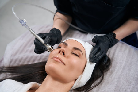 Lady working in salon, doing skin resurfacing procedure