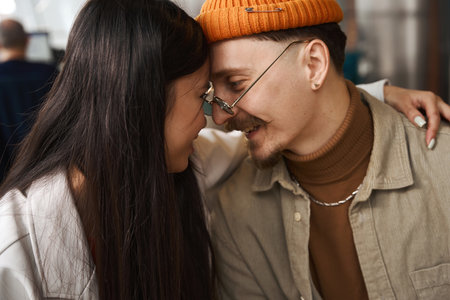 Woman in love embracing man in coworking spaceの写真素材