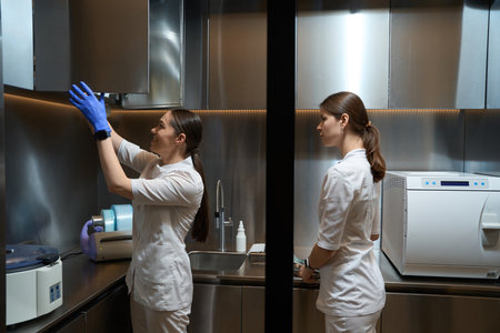 Side view of women health working in laboratory room in clinicの写真素材