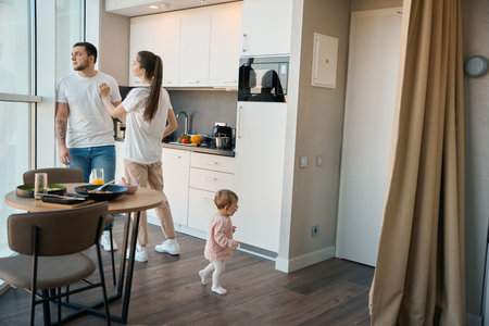 Emotional male and female quarrel in the kitchenの写真素材