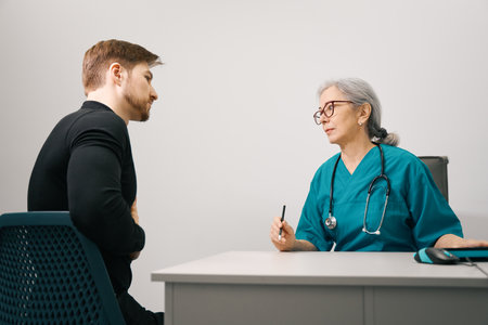 Young bearded man at a therapists appointmentの写真素材