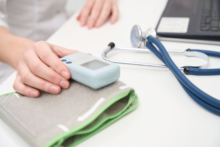 Doctor in the workplace with a tonometer and a stethoscope