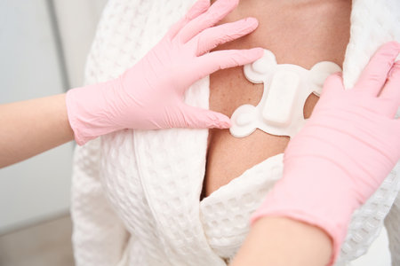 Diagnostician attaches a special sensor for Holter examination