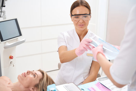 Staff of the aesthetic medicine clinic at work at workplaceの写真素材