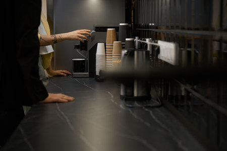 Colleagues preparing coffee on break in the office