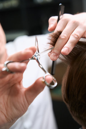 Photo of scissors cutting hair of client indoorsの写真素材