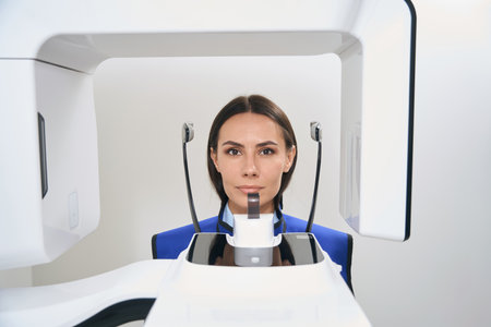 Patient undergoes 3D scanning procedures before tooth extractionの写真素材