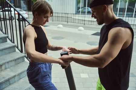 Guy with a girlfriend rent scooter to walk around cityの写真素材