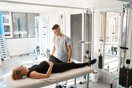 Smiling expectant mother at a comfortable chiropractic session