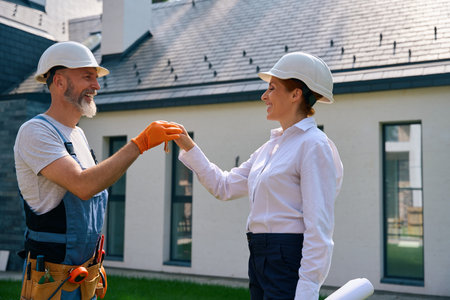 Contractor delivering new building object to development company representative