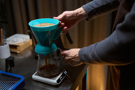 Barista using alternative ways of brewing coffee with filter