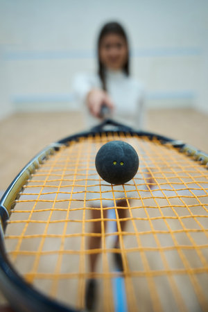 Closeup of squash racket in slim sporty woman handsの写真素材