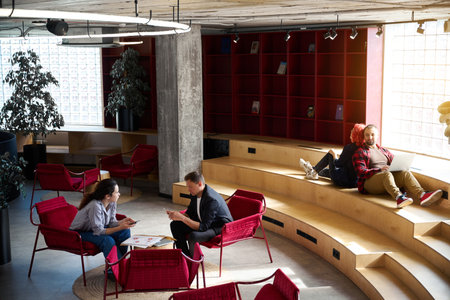 Place with free wi-fi, chairs and tables where people can workの写真素材