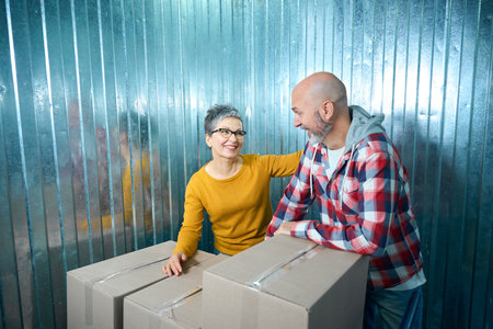 Smiling people talking in a storage roomの写真素材