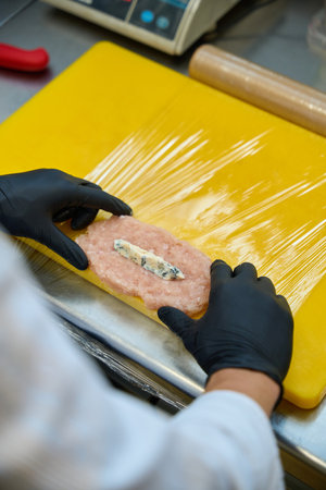 Cook forms a cutlet Kiev styleの写真素材