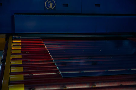 Working with a sheet of glass using thermal equipmentの写真素材