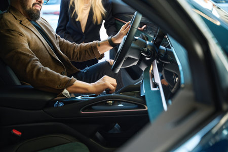 Man sits behind the wheel in a car