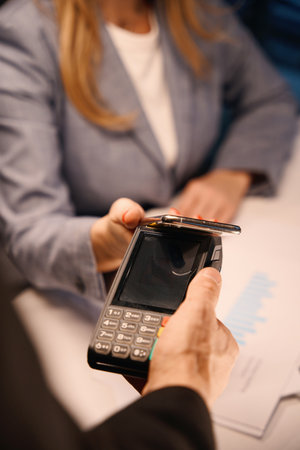 Lady pays bill in restaurantの写真素材