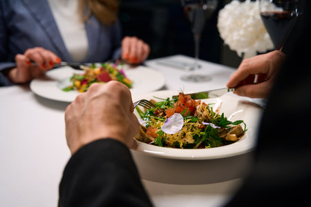 People have dinner in a cozy restaurant