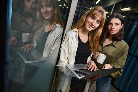 Colleagues in corporate office discussing designing ideasの写真素材