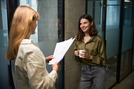 Business women talking about clothing design ideas