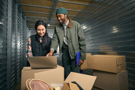 Storehouse workers involved in containerizing boxed goods
