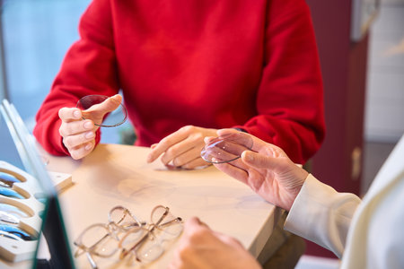 Women are looking at lenses for glasses framesの写真素材