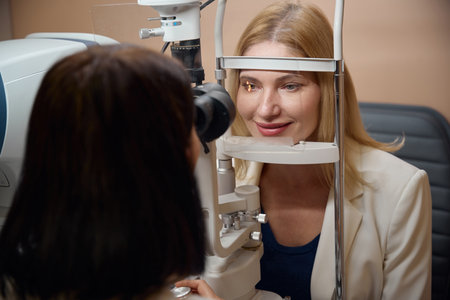 Ophthalmologist performs diagnostics for a young woman