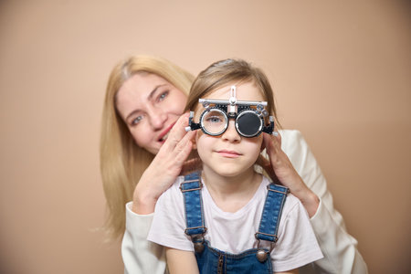 Woman tries on trial lenses for a girl