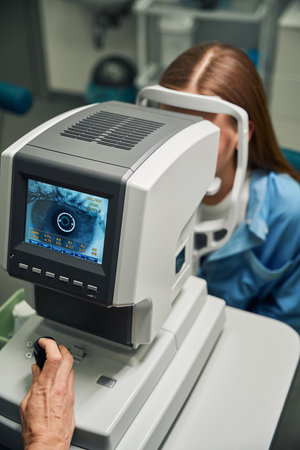 Screen displaying patient eye scan in progressの写真素材
