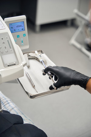 Dentist uses a special syringe at workの写真素材