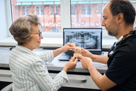 Prosthetist consults an elderly ladyの写真素材