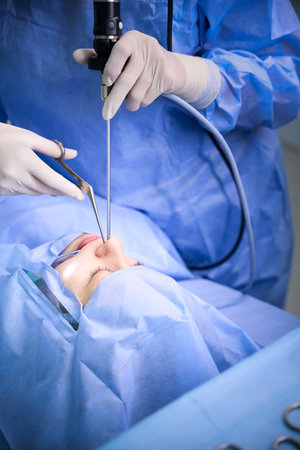 Clinic specialist uses modern technologies during an operation