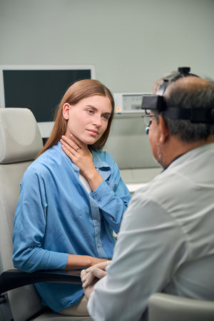 Female caucasian patient listens to doctors instructions