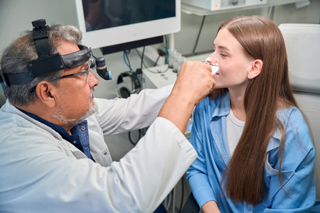 Detailed eye examination with doctor and patientの写真素材