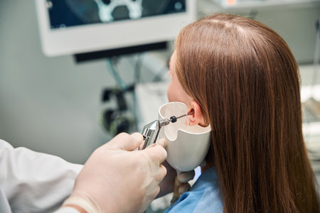 Close-up of ear examination with medical deviceの写真素材