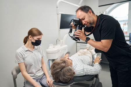 Specialist uses a special dental camera in his workの写真素材