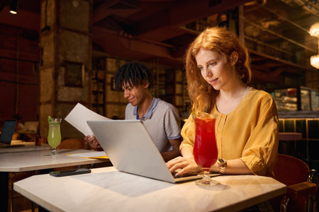 Man and woman reviewing papers togetherの写真素材