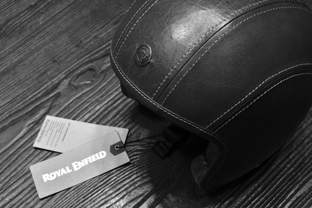 Nonthaburi,THAILAND - April 6, 2018: Classic leather helmet brand Royal Enfield, safety worn to protect the head from injuries. Showed at BANGKOK INTERNATIONAL MOTOR SHOW 2018. black and white image.のeditorial素材