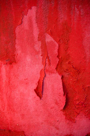 Red wall with cracks , paint stainsの写真素材