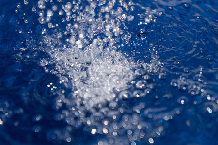 Blue water splashing の写真素材