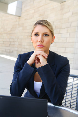 Young pretty business woman thinkingの写真素材