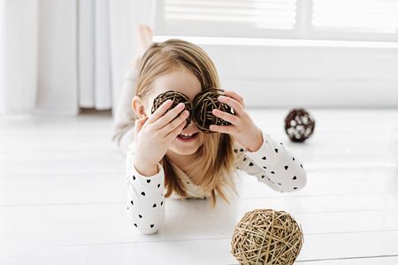 A girl posing in front of a window. High quality photoの写真素材