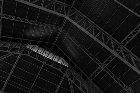 Abstract.metal framework of the roof of industrial premises in the enterprise inside view in black and whiteの写真素材