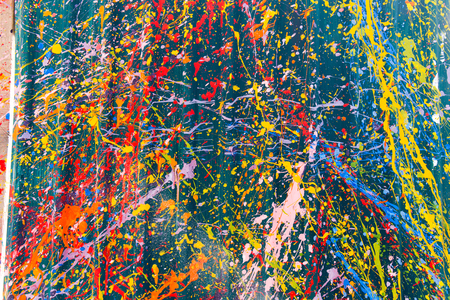 Abstract, Colorful Paint Splash on a green background.の写真素材