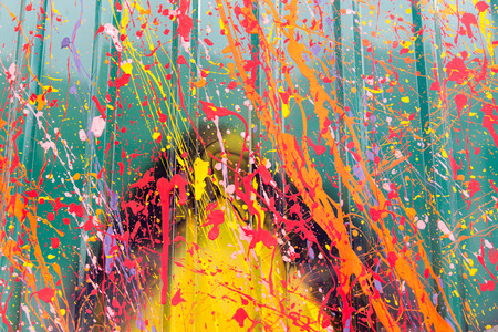 Abstract, Colorful Paint Splash on a green background.