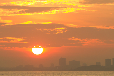 abstract sunrise in the sea view of sea near the town at asiaの写真素材
