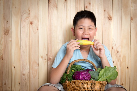 Young boy  with basket of organic Vegetables.の写真素材
