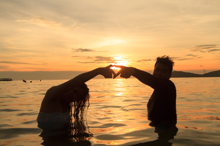 people walk in Sea Sunsetの写真素材