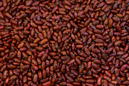 Red kidney bean texture background. Also called Rajma or Mexican Bean. A large, kidney-shaped bean...